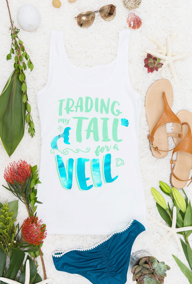 Super cute "Traded My Tail for a Veil" and "Time to Party Our Tails Off" teal foil beachy mermaid bachelorette party shirts available at bachette.com